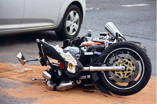 Concept of Atlanta motorcycle accident lawyer, motorcycle hit by car