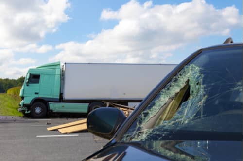 Concept of Atlanta truck accident lawyer, car hit by commercial truck