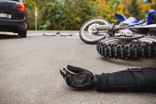 Motorcycle hit by car, concept of Gwinnett motorcycle accident lawyer