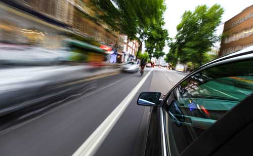 Speeding car, concept of Gwinnett reckless driving accident lawyer