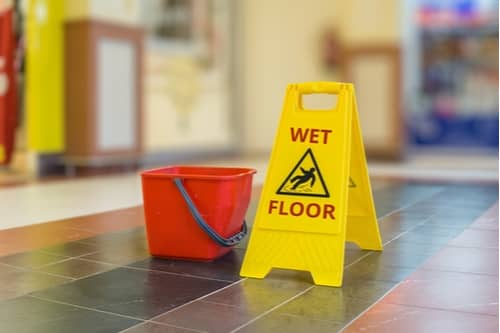 Wet floor sign, concept of Macon slip and fall accident lawyer