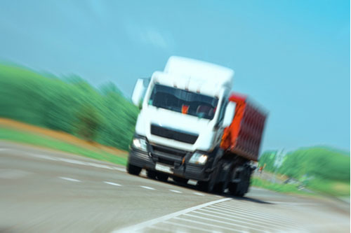concept of Milledgeville truck accident lawyer, speeding truck