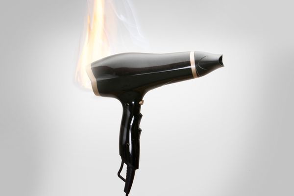A hairdryer on fire of someone that needs to call an Atlanta product liability lawyer