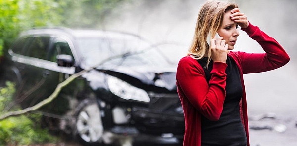 A woman calling police after a hit-and-run accident